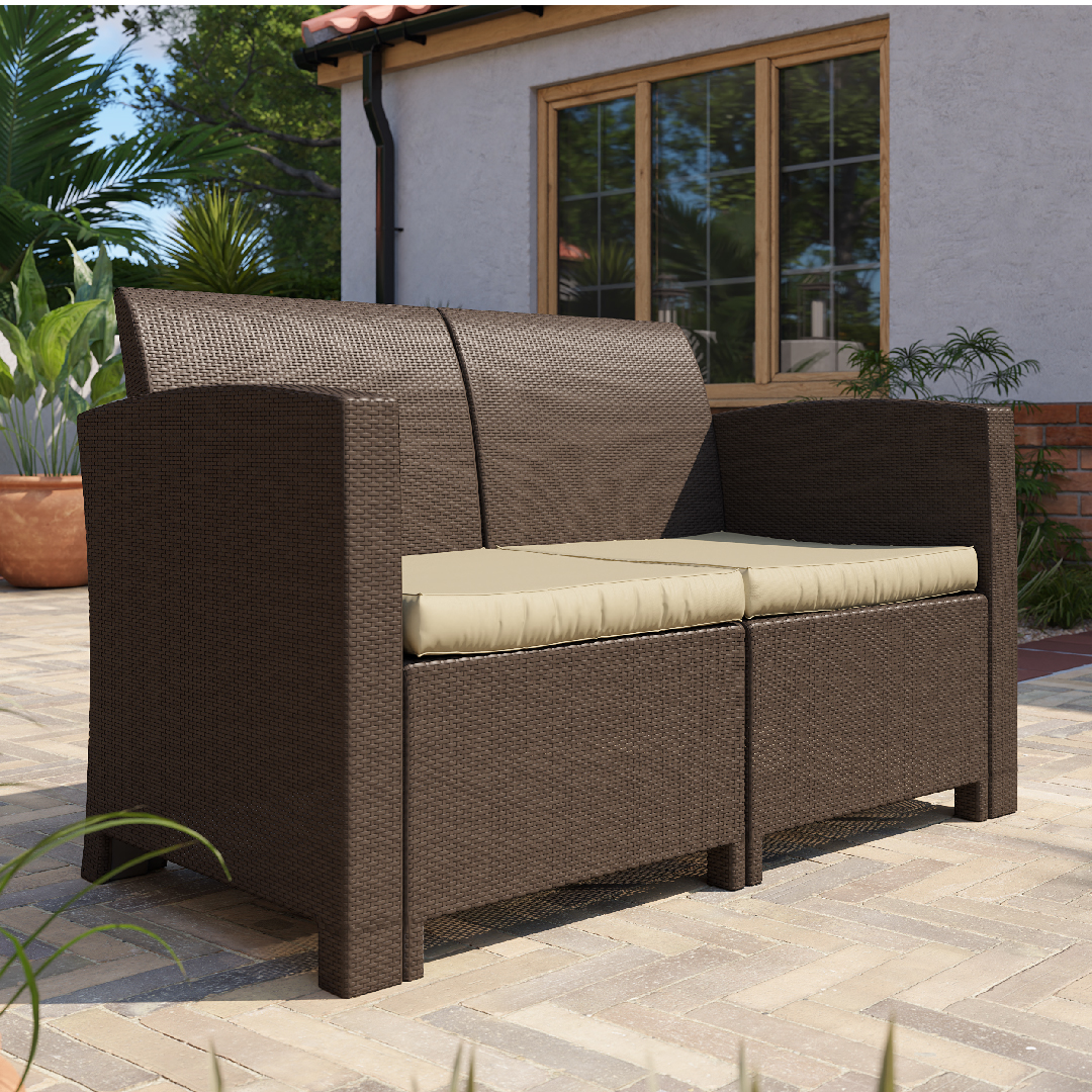 Click to view product details and reviews for 2 Seater Rattan Effect Sofa In Brown With Cream Cushions.